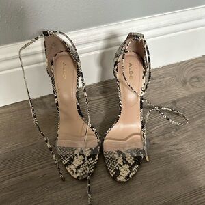 Aldo Black and Cream High-Heeled Pumps